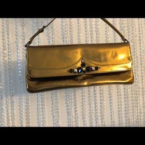 Giuseppe Zanotti Gold clutch with Rhinestones.